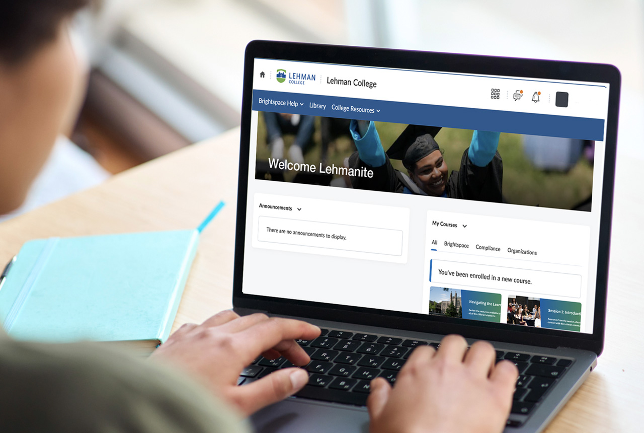 Student viewing the Lehman College Brightspace homepage on a laptop