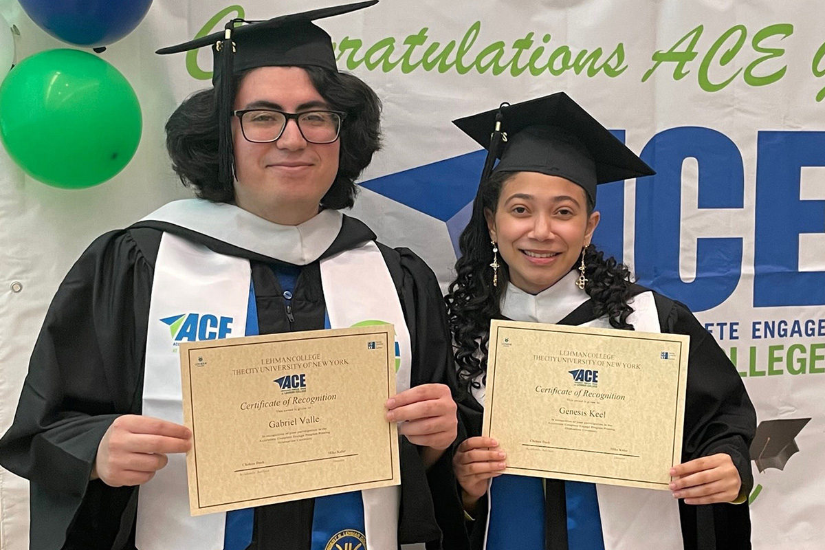 Photo of two graduating students from ACE Program showing their diplomas