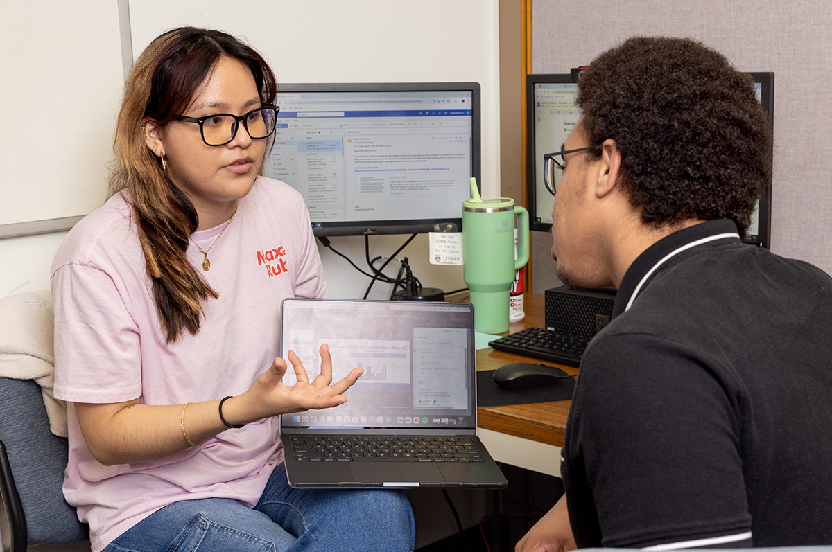 Photo of tutor helping a student