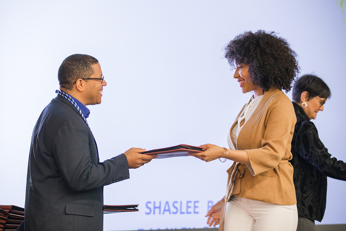 Photo of student getting diploma at a ceremony
