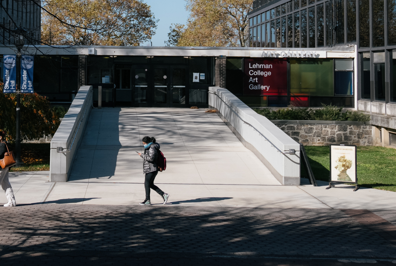 A female student walks by the Lehman College Art Gallery.