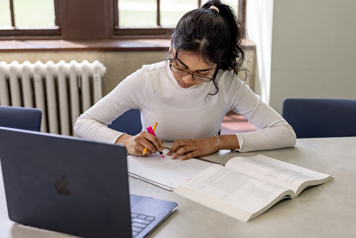 Photo of student writing in notebook