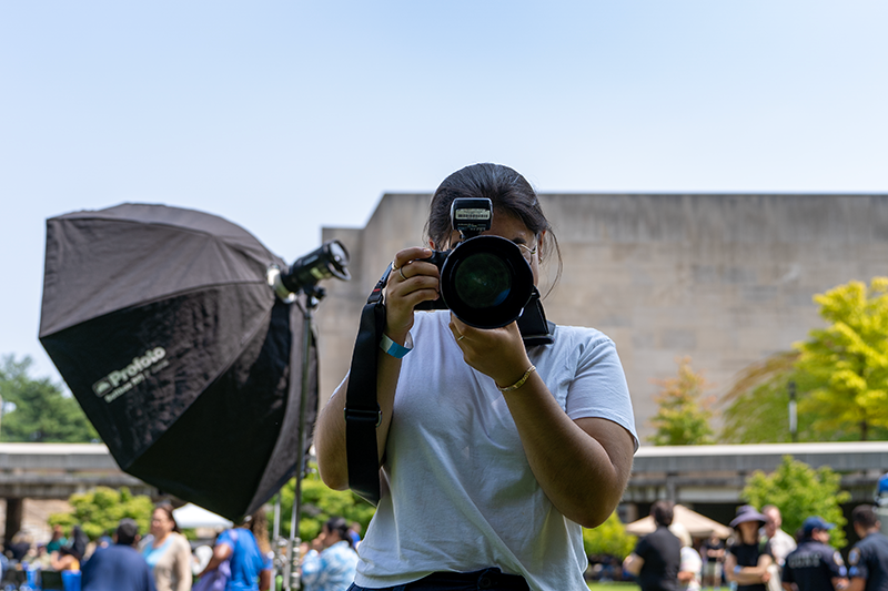 Luisa Sotelo Cristanos snaps a picture at the annual employee barbecue.