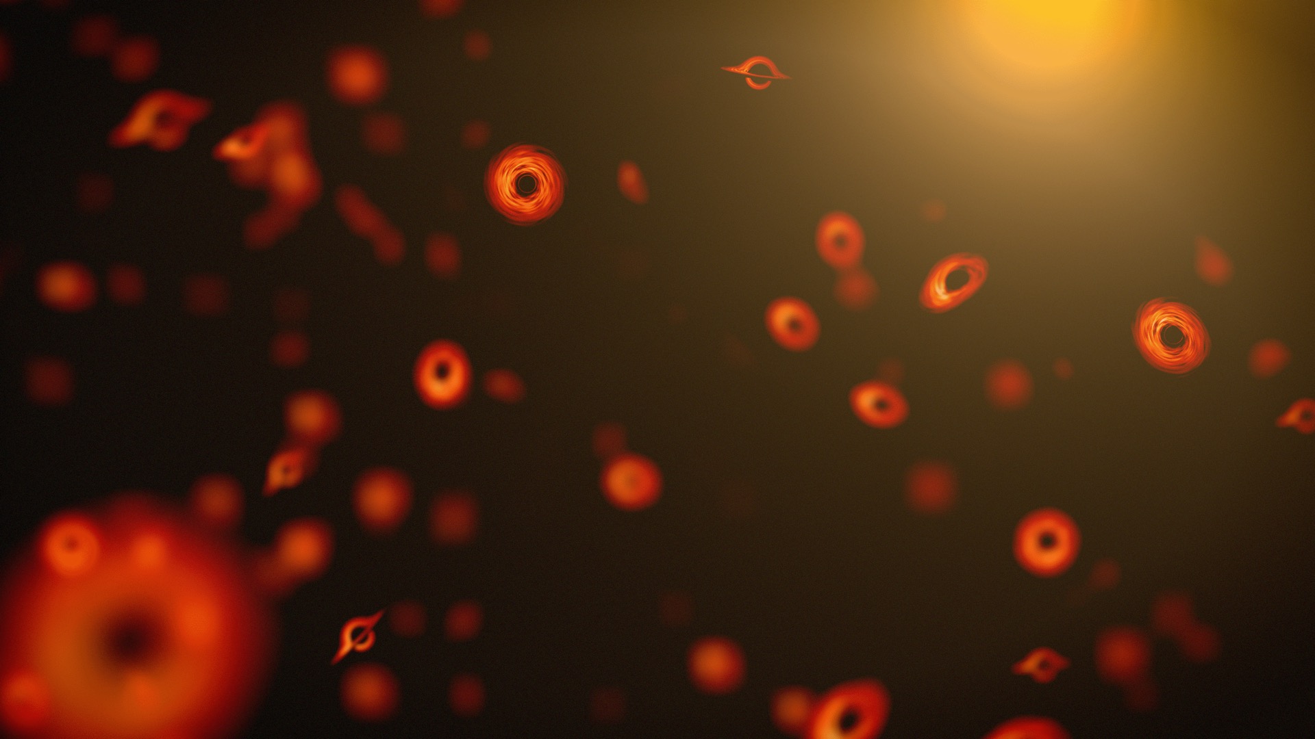 a cloud of small glowing red rings in a black background