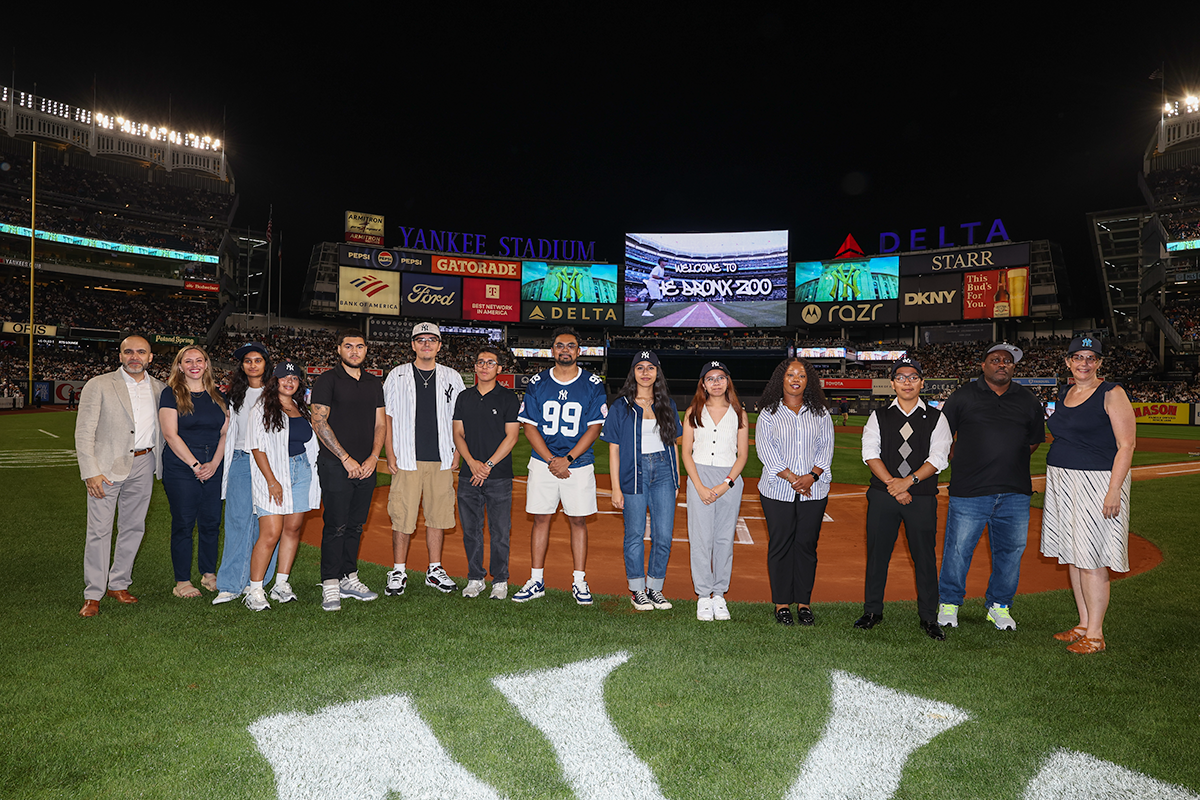 Students from the Lehman College/New York Yankees Sports Management Speaker Series receive their certificates at Yankee Stadium