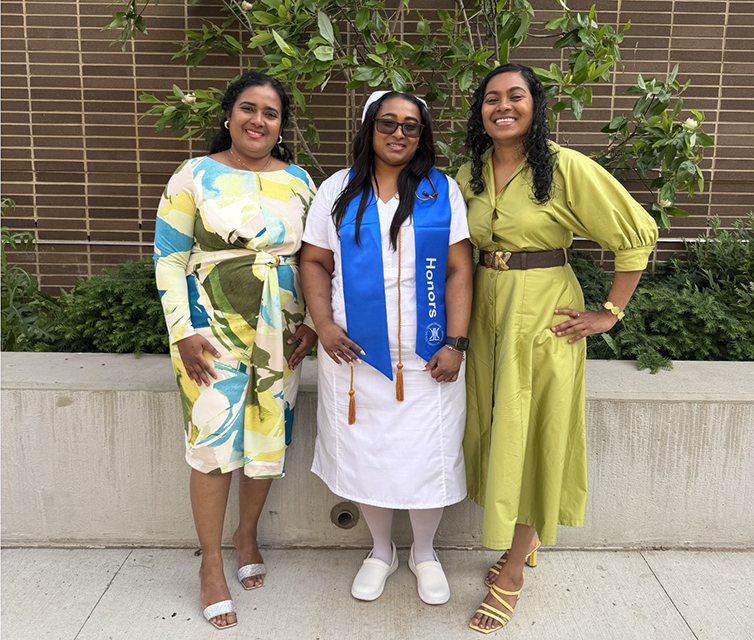 Rosanna, Arlene, and Andrea Ramsudh pose after the Department of Nursing pinning ceremony. Arlene is in a nurse