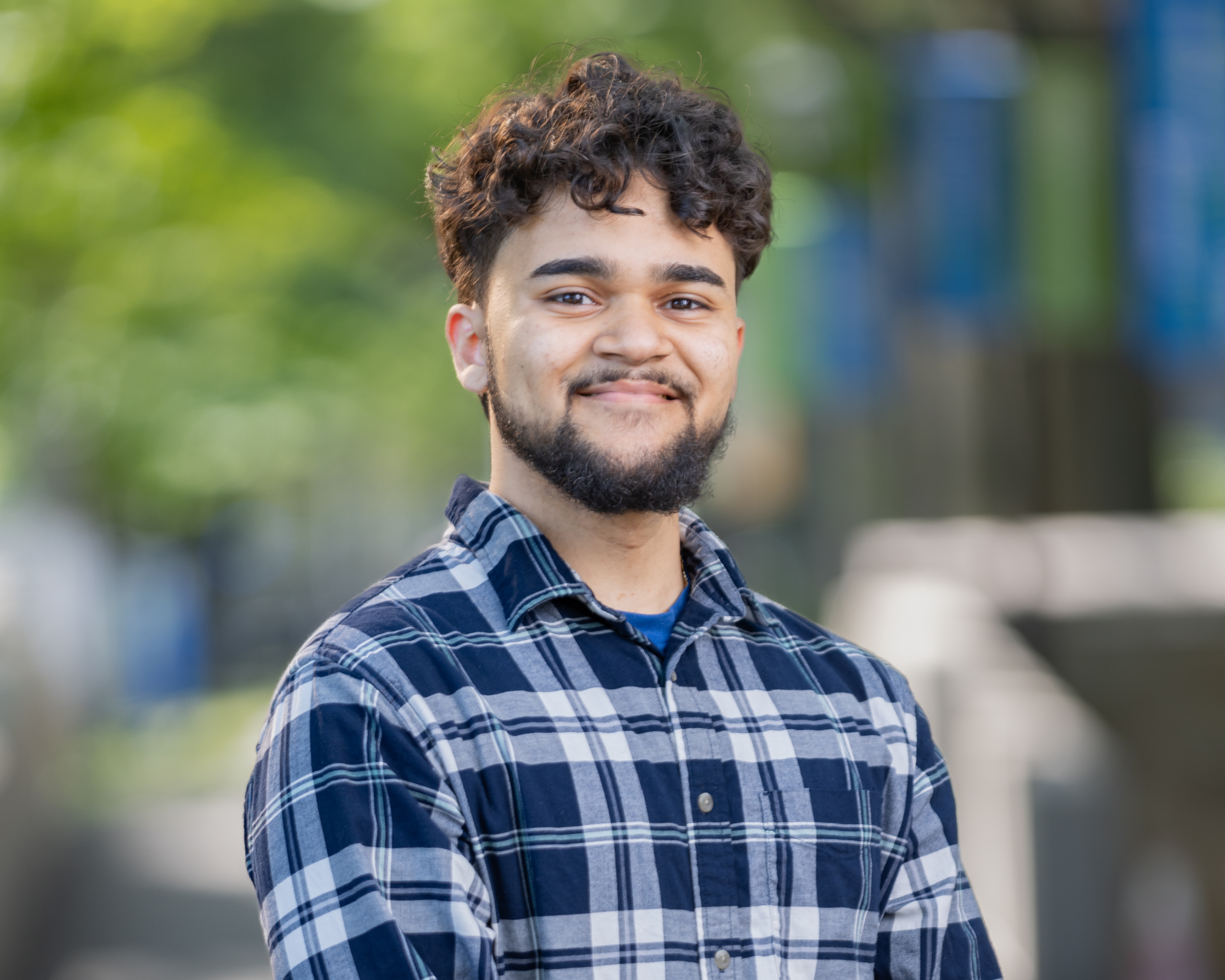 A smiling man outside.