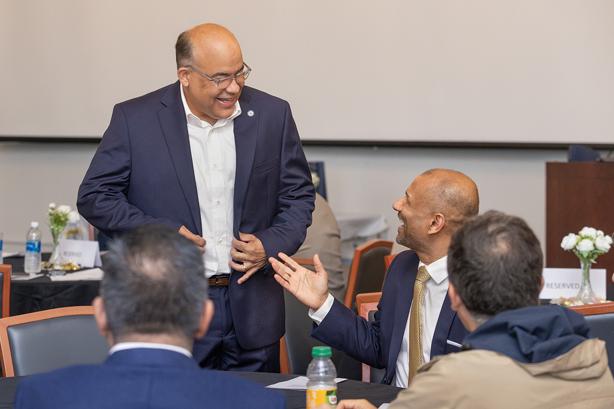 Photo of Provost with other staff