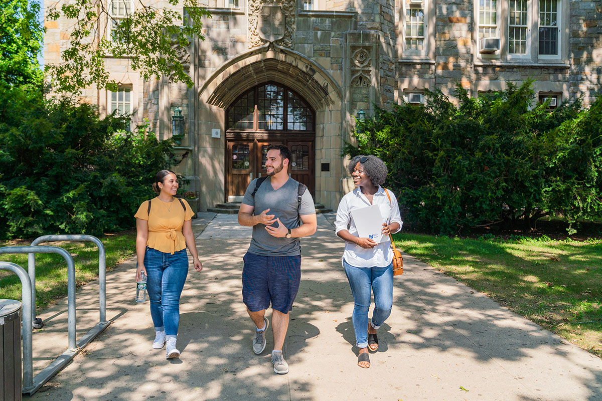 Photo of three students on campus