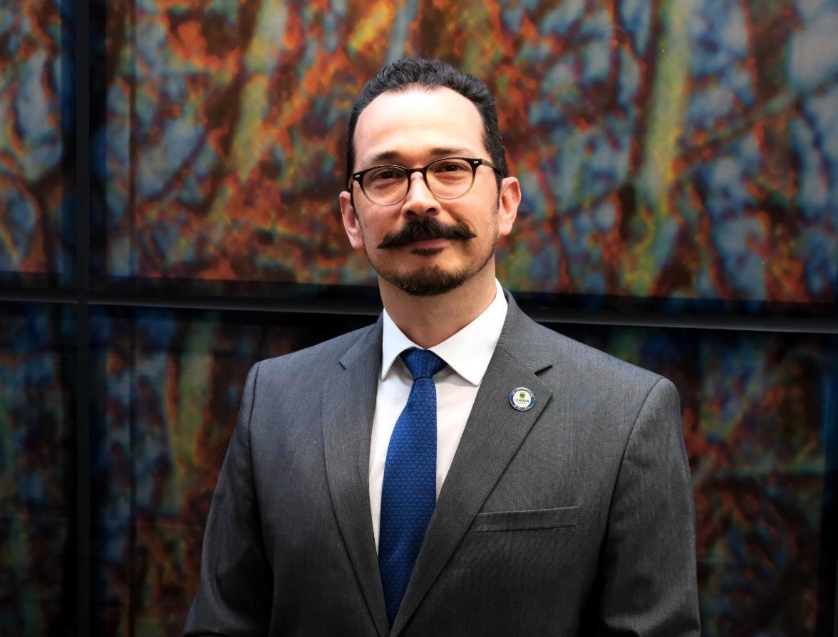 CUNY Mexican Studies Institue, dancers pose with the Olmec Head on the Lehman Campus