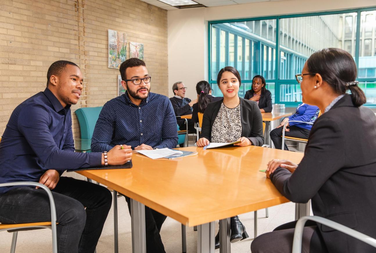 People sitting around a table having a meeting