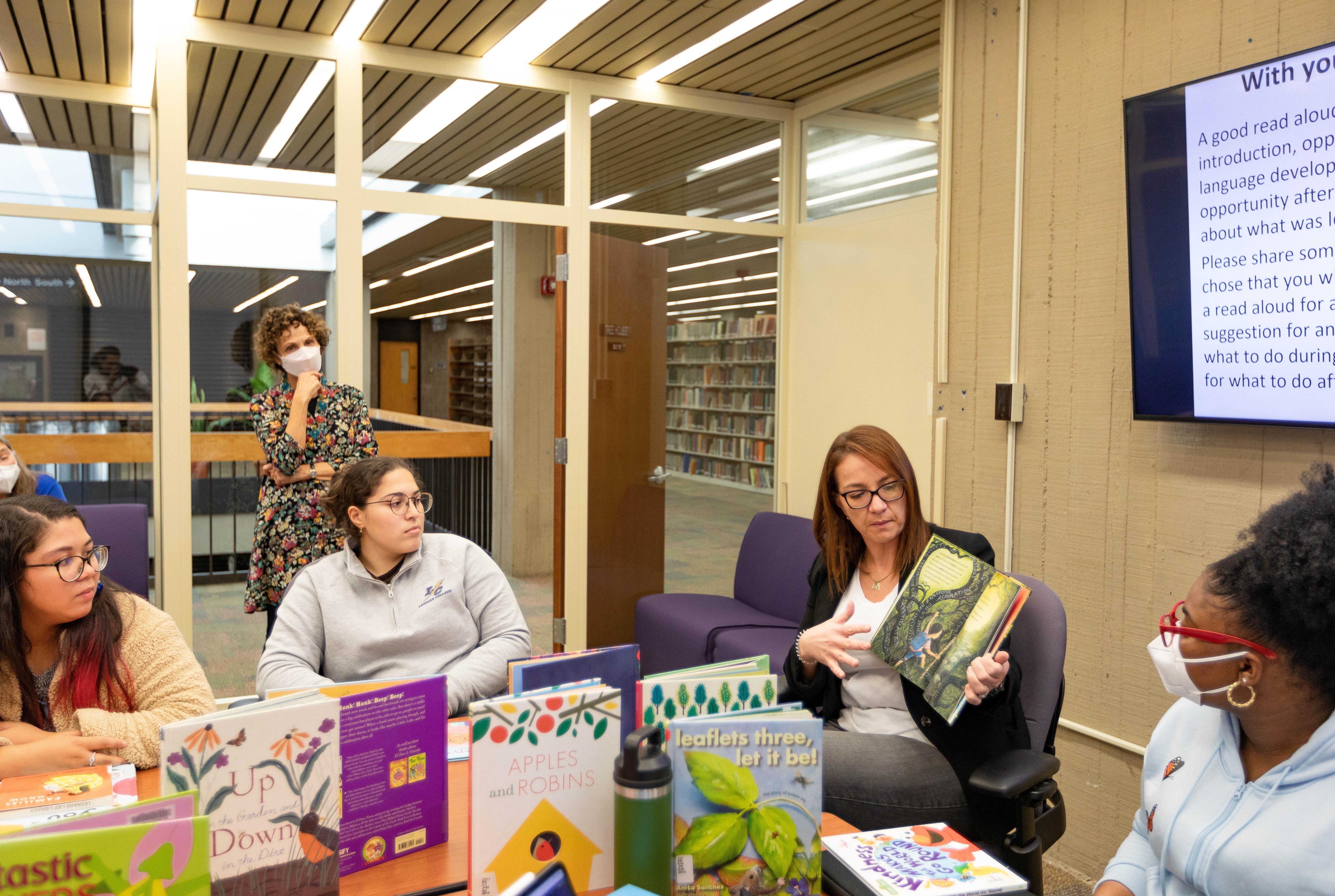 Teachers with children's books