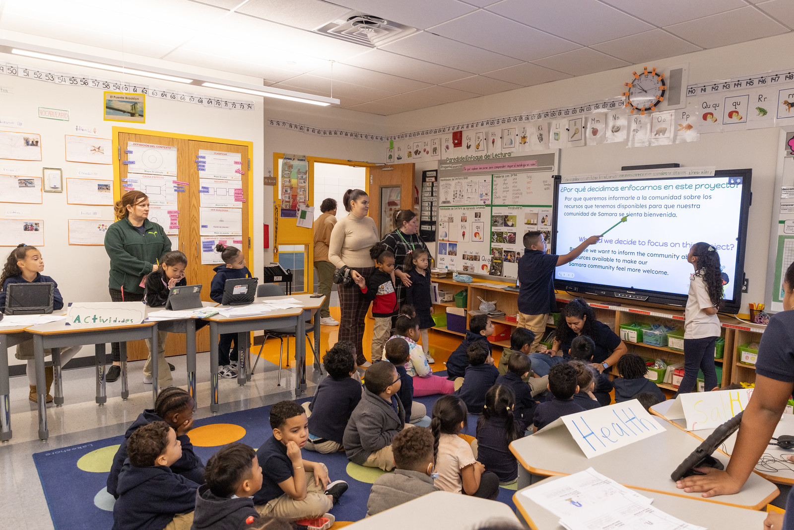 Teacher teaching children for LUTE Multi