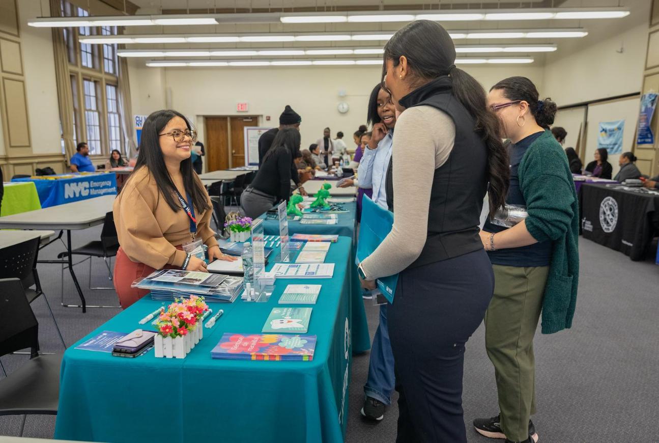 Student at an information table