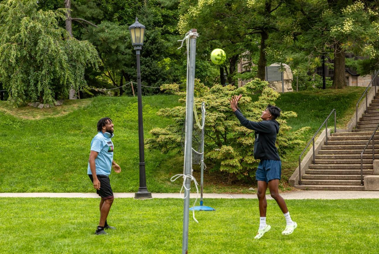 Two Student playing Vollyball