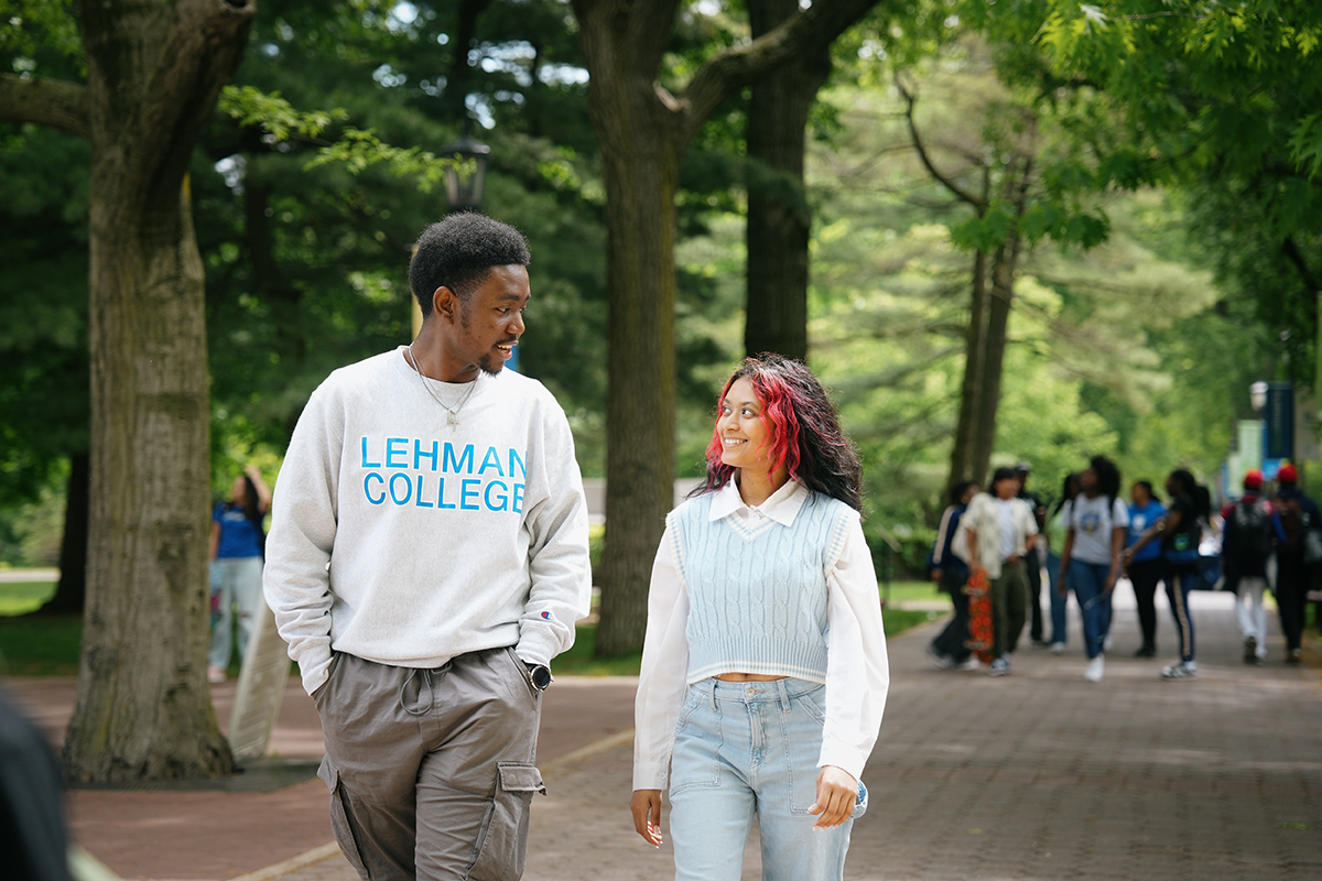 Photo of two students walking on campus