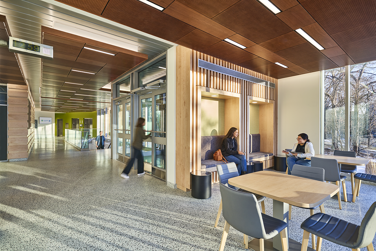 Students sitting and talking while inside building